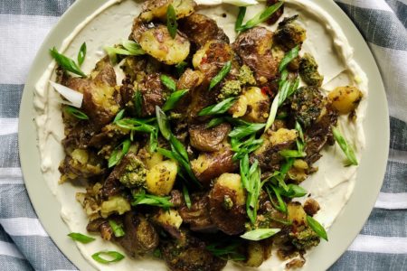 Smashed Crispy Potatoes with Calabrian Chili Basil Pesto & Lemon “Cream”