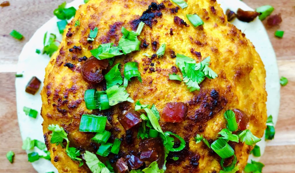 Whole Roasted Cauliflower with Turmeric, Fennel Seed, & Dates